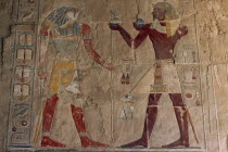 Deir-el-Bahri. Hatshepsut Mortuary Temple. Chapel of Anubis. Relief of Tuthmosis III making offerings to the sun god Ra- Harakhty.African Middle East North Africa History Religion Religious