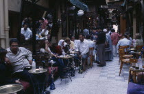 Fishawi s coffee house in the Khan el-Khalili bazaar with men and women sitting at tables with water pipes used for smoking sheesha or hubble bubble.CafeAfrican Middle East North Africa Bar Bistro F...