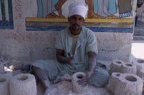 Alabaster carver making items for tourists in Gurna village African Middle East North Africa One individual Solo Lone Solitary
