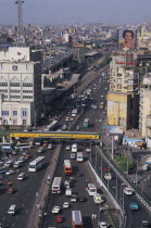 Elevated view over busy city road network with traffic running between tall buildingsAfrican Middle East North Africa