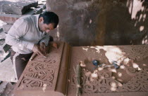 Craftsman carving a khatchkar or memorial stone.Armenian Asia Asian European Middle East Religion Religious One individual Solo Lone Solitary