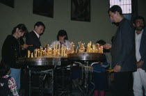 Adults and children lighting candles inside church.Etchmiadzin Armenian Asia Asian European Kids Middle East Religion Religious