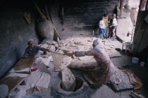 Women baking traditional flat bread or lavash also known as Armenian Cracker Bread.cooking Asia Asian European Middle East Classic Classical Female Woman Girl Lady Historical Older Female Women Girl...