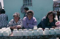 Women selling yogurt in market.Armenian Asia Asian European Middle East Female Woman Girl Lady Female Women Girl Lady