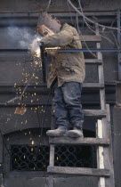 Welder working on new shop front.Asia European Store Armenian Asian Middle East One individual Solo Lone Solitary