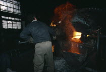 Cable factory worker in front of furnace with flying sparks.Armenian Asia European Asian Middle East One individual Solo Lone Solitary