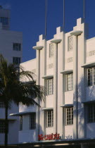 South Beach. Ocean Drive. The Carlyle Hotel seen in early morning light with a palm tree casting a shadow on the exterior American North America United States of America Beaches Resort Sand Sandy Sea...