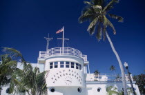 South Beach. Ocean Drive. Beach Patrol Headquarters building with an American flag flying from the roof surrounded by palm treesArt Deco American North America United States of America Beaches Resor...