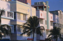 South Beach. Ocean Drive. Art Deco hotels and palm trees seen in early morning lightAmerican North America United States of America Beaches Resort Sand Sandy Seaside Shore Tourism