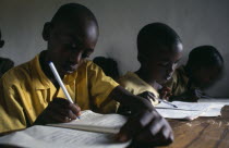 Mixed Hutu andTutsi pupils at school.  New classrooms have been built to cope with the influx of Tutsi returnees from Uganda.