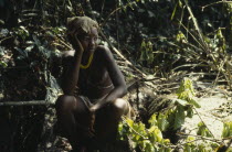 Young Mende tribeswoman dressed for Sande society initiation into adulthood.