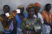 Sierra Leonean refugees queuing for food rations at Kissidougou camp.