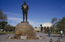 Statue of Seretse Khama the first President of Botswana with the National Assembly building behind.