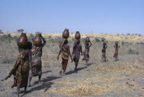 Kanimbo women fetching water.