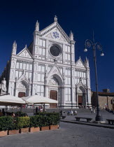 Santa Croce Church  Neo-Gothic facade by Niccol Matas added in 1863 with people on steps to entrance and in cafe in the piazza partly seen in the foreground.Bar Bistro Firenze Italia Italian Religio...