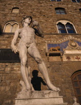 Piazza della Signoria.  Copy of Michelangelos statue of David outside Palazzo entrance in evening light.Firenze Italia Italian Southern Europe Warm Light European Toscana Tuscan