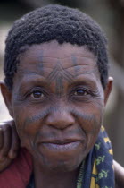 Portrait of woman with facial tattoos.