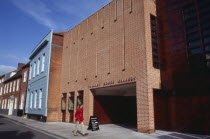 Pallant House Gallery exterior with a man wearing a red jacket walking past entranceEuropean Great Britain Male Men Guy Northern Europe One individual Solo Lone Solitary UK United Kingdom