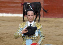 Bullfight. A matador salutes the presiding dignitary before the tercio de muerteBull fight American Cattle Hispanic Latin America Latino Male Mexican One individual Solo Lone Solitary