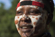 Karo woman with face painting.