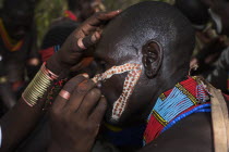 Hama Jumping of the Bulls initiation ceremony  Face painting with a mixture of clay  oils and plant pigment