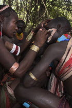 Hama Jumping of the Bulls initiation ceremony  Face painting with a mixture of clay  oils and plant pigment