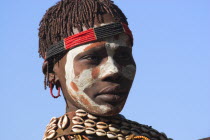 Banna woman with painted face.