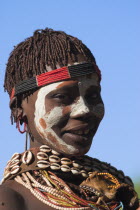 Banna woman with painted face.