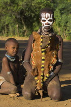 Karo lady with child with face painting