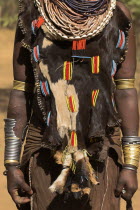 Womans necklaces and traditional goatskin dress decorated with cowrie shells Jane Sweeney