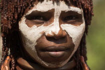 Banna woman  her hair greased with ocher colouring and animal fat into plaits known as Goscha Jane Sweeney