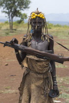 Woman with kalashnikov.