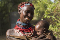 Karo woman holding baby