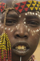 Karo girl with face painting.