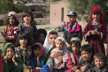 Aimaq nomad camp  Aimaq lady with children   The Aimaq are semi nomadic people who move out of their mud house villages after spring and live in yurts to tend their flocks before moving back to their...