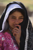 Shy Aimaq nomad camp  Aimaq girl   The Aimaq are semi nomadic people who move out of their mud house villages after spring and live in yurts to tend their flocks before moving back to their houses in...