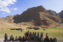 Aimaq nomad camp  Aimaq man with children   The Aimaq are semi nomadic people who move out of their house villages after spring and live in yurts to tend their flocks before moving back to their house...