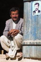 Man sitting in doorway