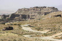 Military graveyard with ancient city walls and Citadel in background  the Citadel was destroyed during First Anglo Afghan war since rebuilt and still used as a military garrison