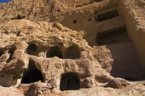 Caves in cliffs near empty niche where the famous carved small Budda once stood 180 foot high before being destroyed by the Taliban in 200