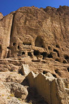Caves in cliffs near empty niche where the famous carved small Budda once stood 180 foot high before being destroyed by the Taliban in 2001