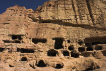 Caves in cliffs near empty niche where the famous carved small Budda once stood 180 foot high before being destroyed by the Taliban in 2001Jane Sweeney