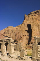 Remains of bazzar which was destroyed by the Taliban infront of empty niche where the famous carved Budda once stood  destroyed by the Taliban in 2001