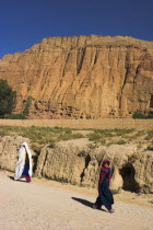 Bamiyan  Remains of bazzar which was destroyed by the Taliban infront of empty niche where the famous carved Budda once stood  destroyed by the Taliban in 2001