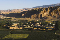 View of Bamiyan valley and village showing cliffs with empty niche where the famous carved Budda once stood  destroyed by the Taliban in 2001