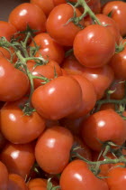 Bunch of red tromatoes on sale in market . Shoreham-by-Sea.