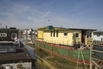 Houseboat moored along the banks of the river adur.  Former barges and old boats converted into homes .