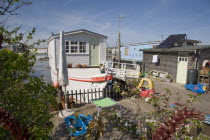 Houseboat moored along the banks of the river adur.  Former barges and old boats converted into homes .