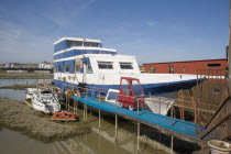 Houseboat moored along the banks of the river adur.