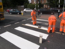 White lines being painted on Zebra Crossing.